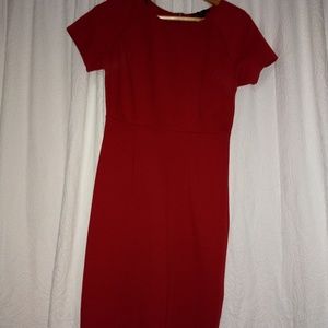 Red dress fits the body.